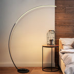 Modern arc floor lamp with sleek LED lighting for stylish bedroom and living room décor.
