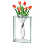 Modern glass and metal vase with red tulips for stylish contemporary home decor.
