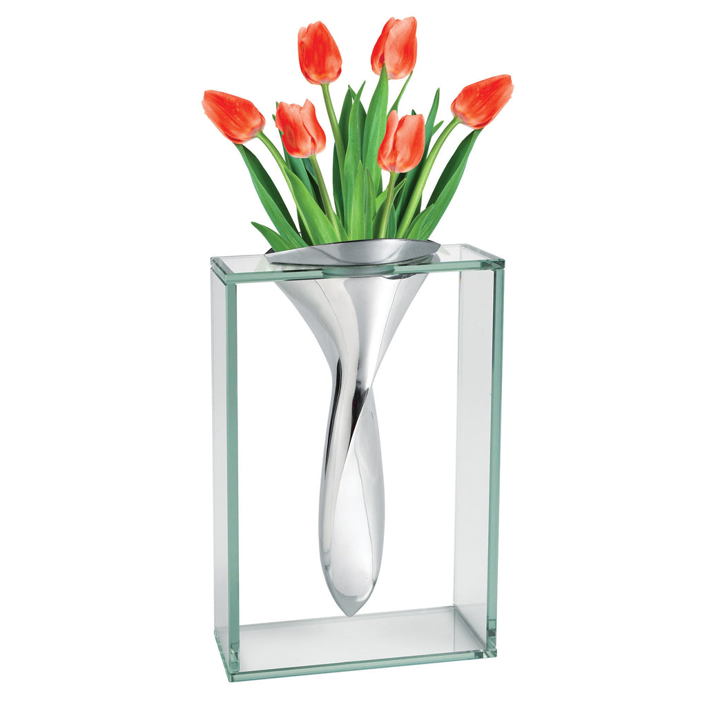 Elegant modern glass and metal vase with tulips for contemporary home decor.

