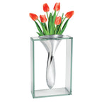 Elegant modern glass and metal vase with tulips for contemporary home decor.

