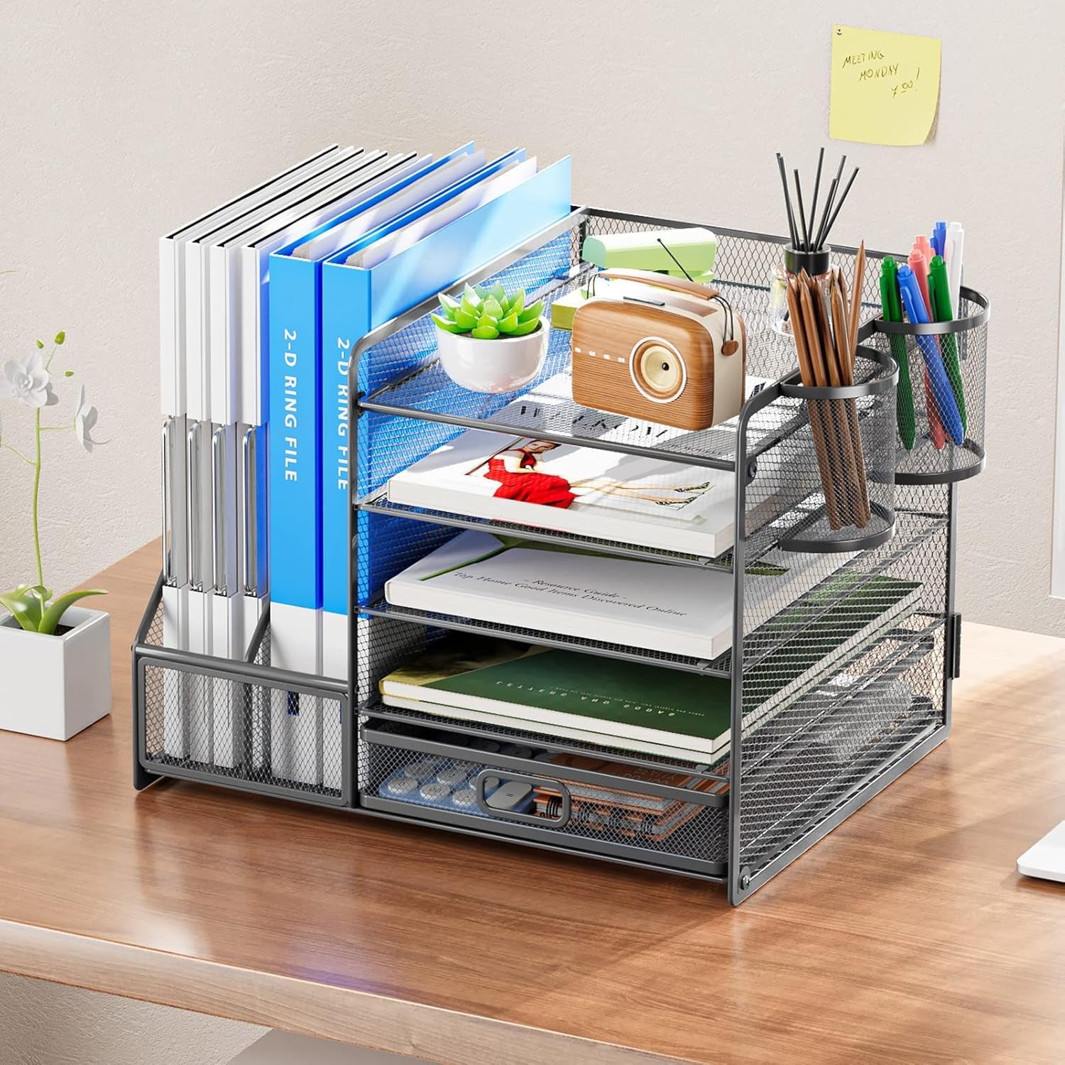 Mesh desk organizer with books, shelves, and pen holders on office desk