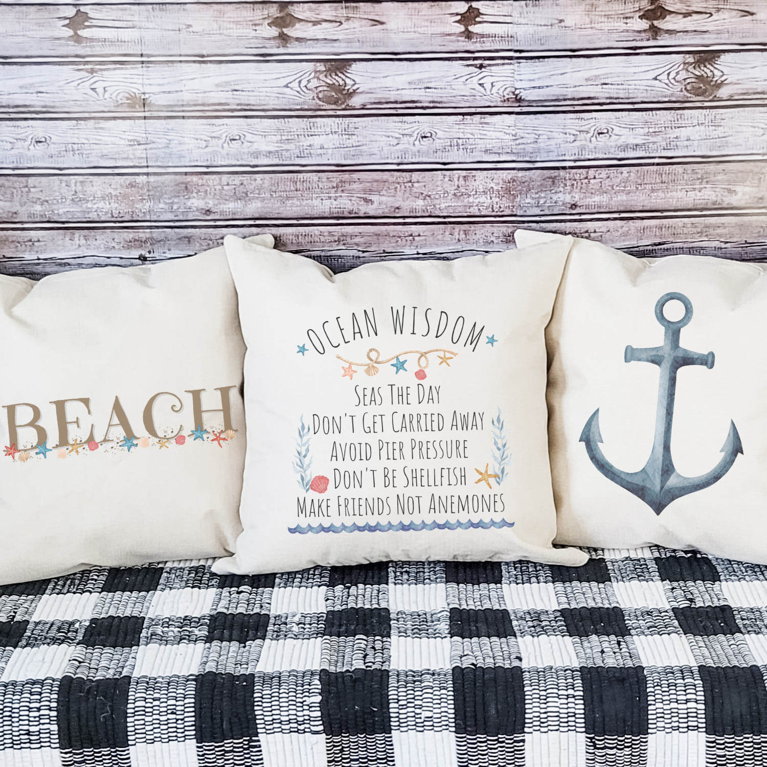 Coastal throw pillow set with beach, anchor, and ocean quotes for nautical home decor.
