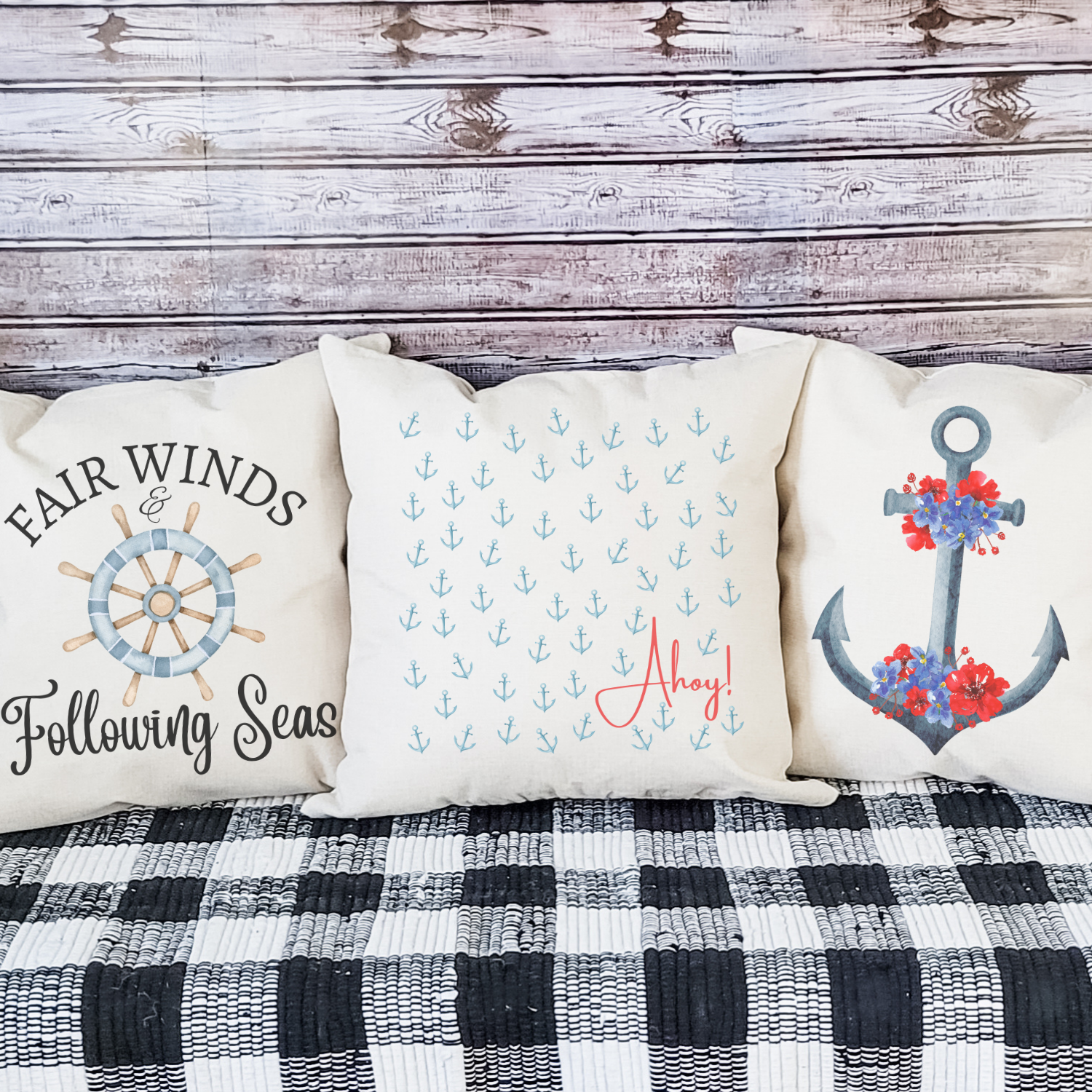 Coastal nautical throw pillows with anchor and ship wheel designs for beach house decor.
