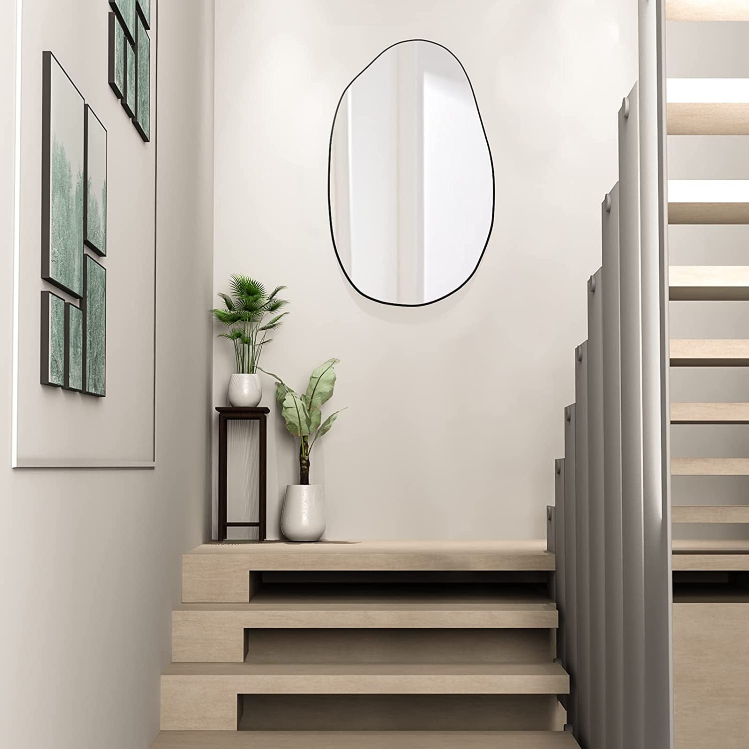 Irregular oval wall mirror with black frame, perfect for staircase or hallway decor.
