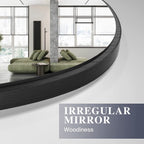 Close-up of irregular wall mirror with sleek black wooden frame for modern home decor.
