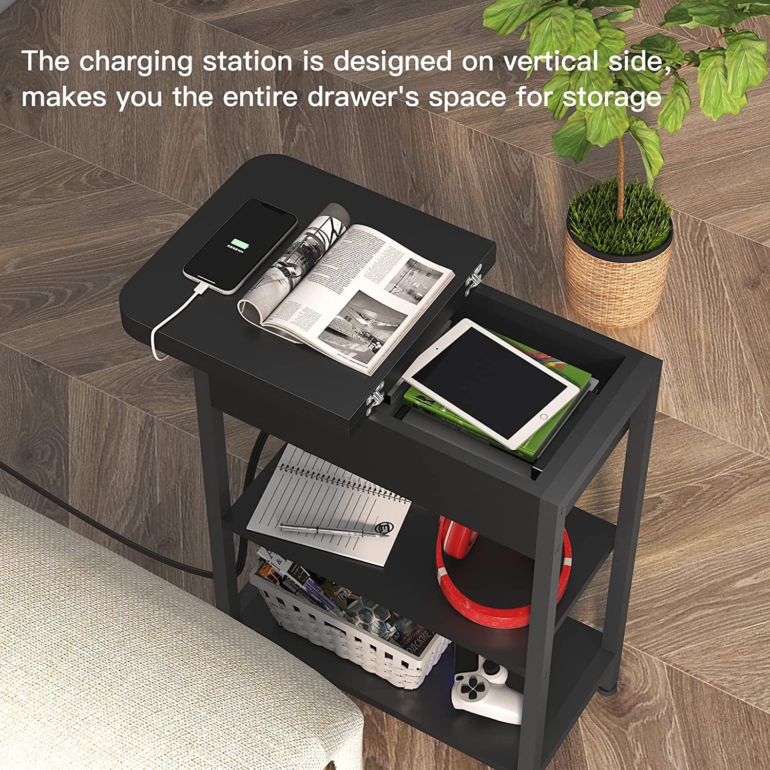 Slim black side table with storage shelves and vertical charging station.

