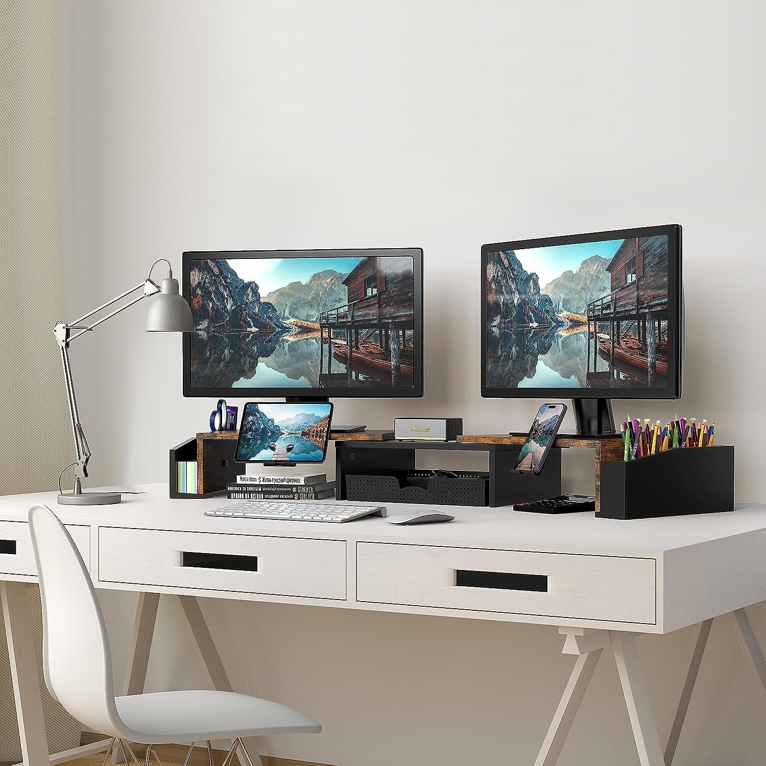 Dual monitor desk setup with wooden stand and organized storage