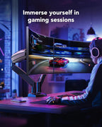 Gamer using dual curved monitors on adjustable desk mount