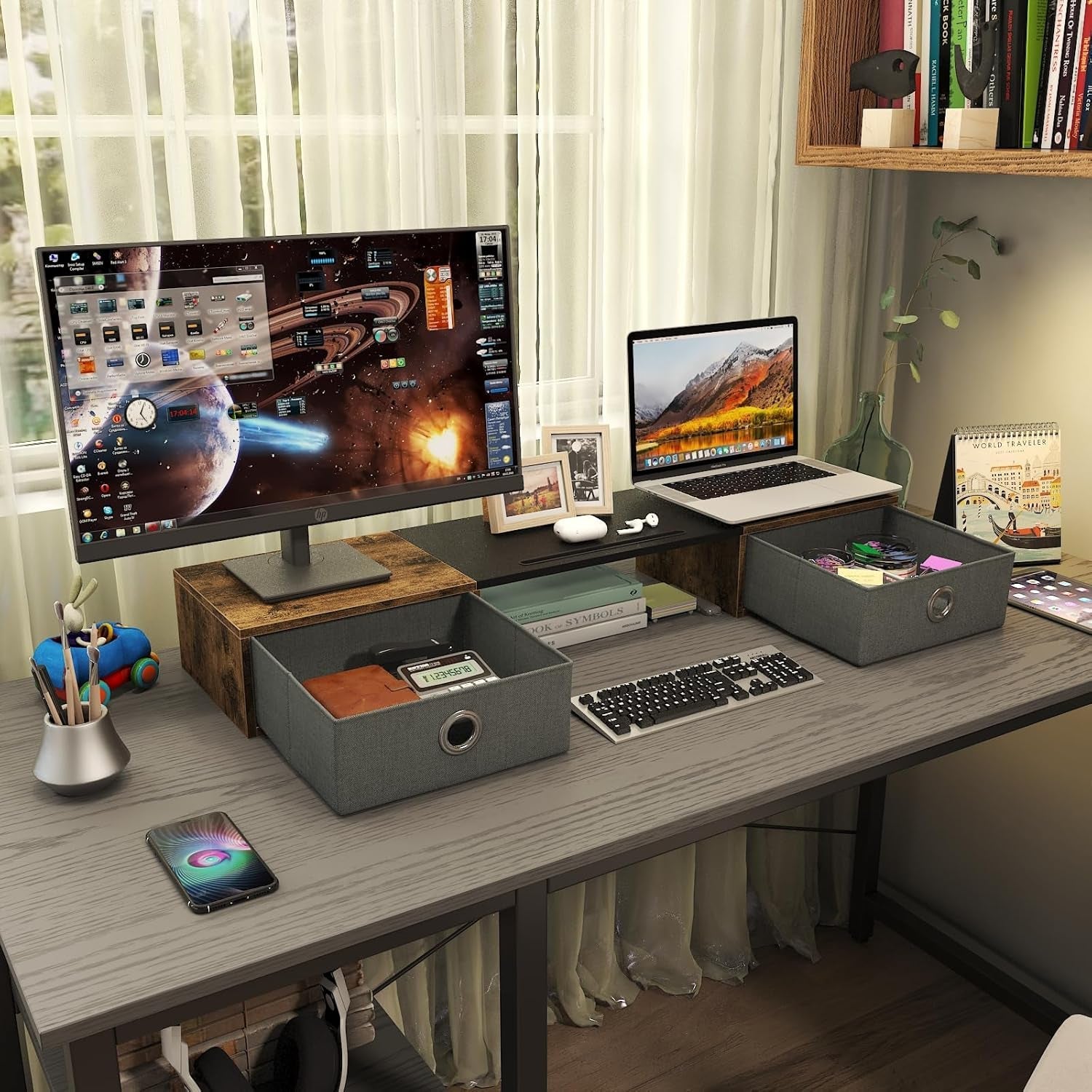 Computer desk setup with monitor stand and storage drawers