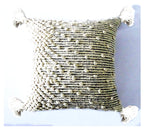 Handwoven boho throw pillow with textured design and tassels for rustic home decor.

