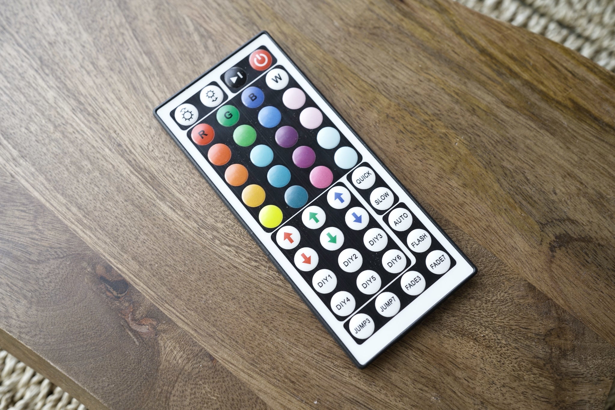 Multicolor LED floor lamp remote control with brightness and mode settings.
