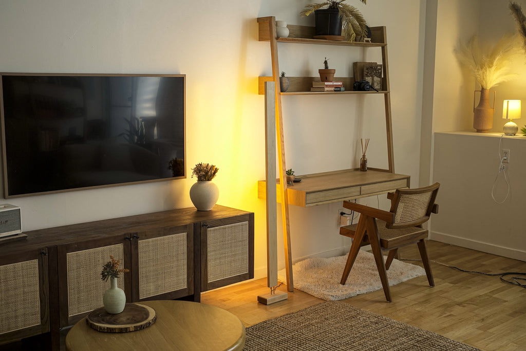 Warm yellow LED corner floor lamp with wooden base for cozy living room lighting.
