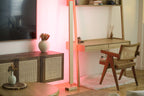 Modern wooden LED corner floor lamp with red ambient lighting for stylish decor.
