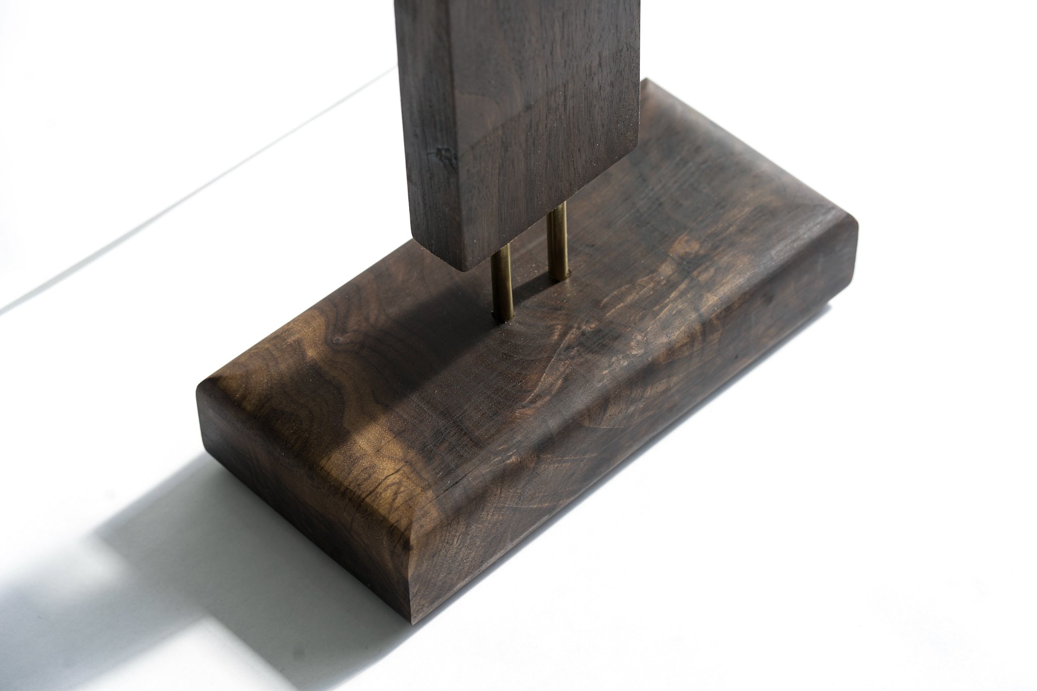 Durable dark wood base for LED corner floor lamp with modern style.
