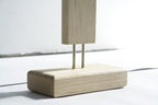 Light wood base for LED corner floor lamp with sleek modern design.
