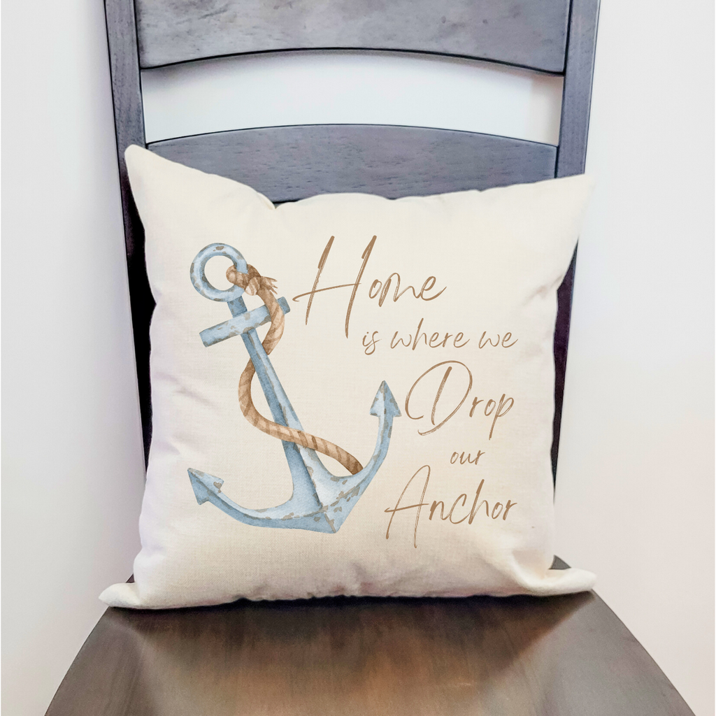 Nautical pillow with anchor design and “Home is where we drop our anchor” quote.
