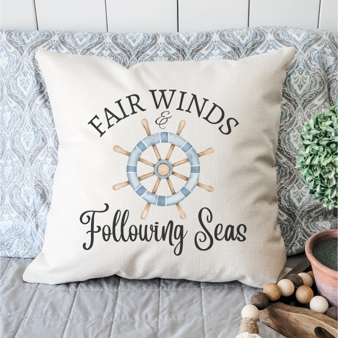 Nautical decorative pillow with ship wheel design and quote for coastal home decor.
