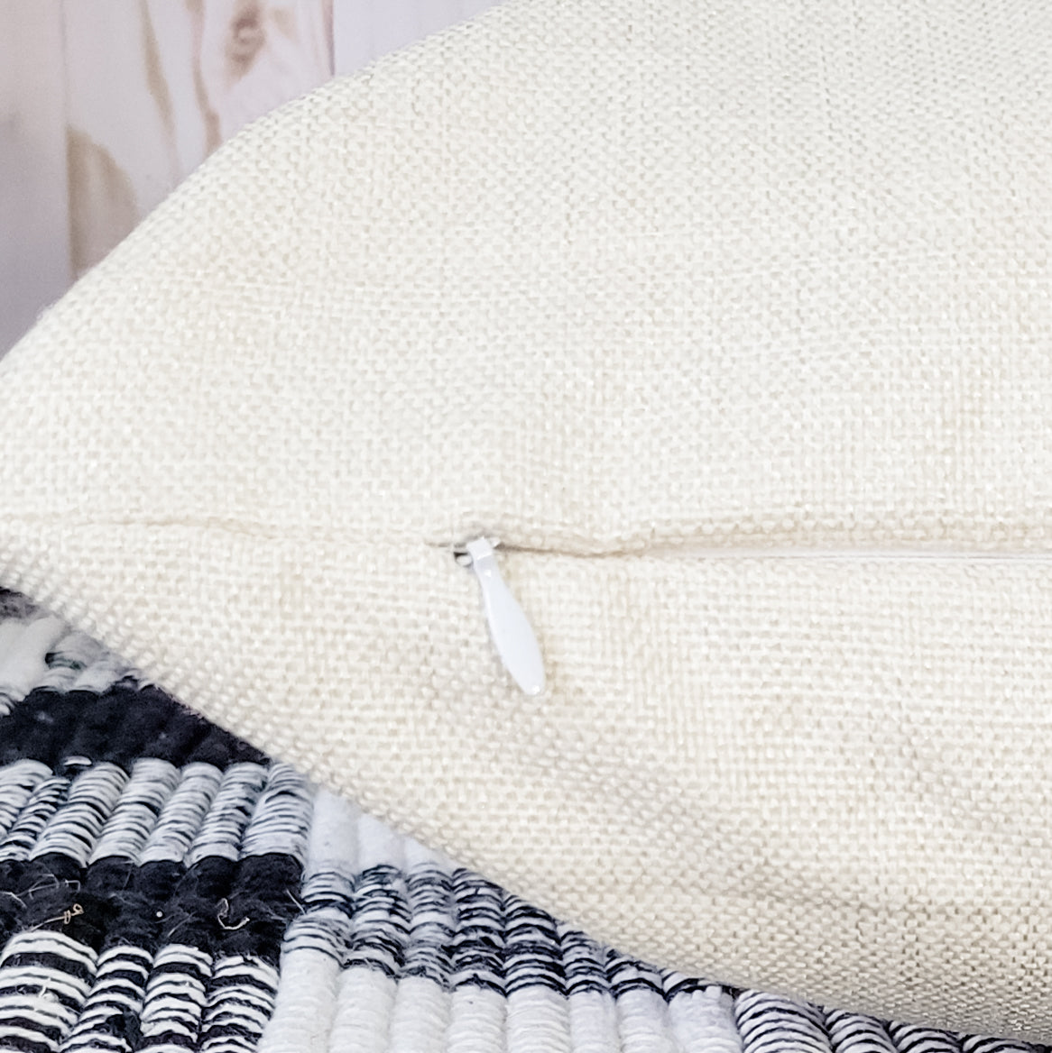 Beige pillow cover with concealed zipper closure for easy insert removal and cleaning.
