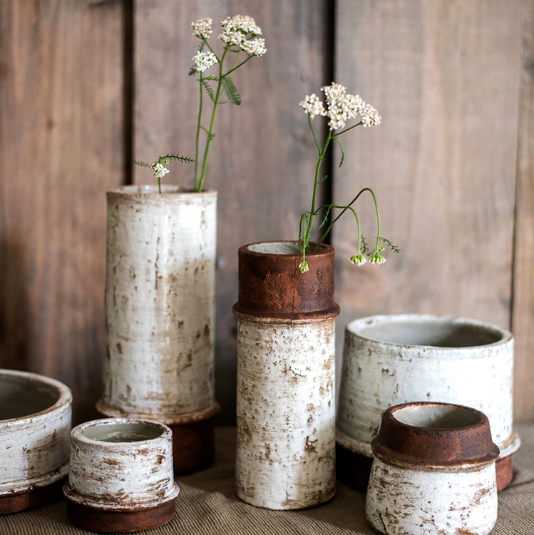 Rustic ceramic vases set with distressed finish for farmhouse floral and home decor.
