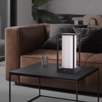 Modern rectangular table lamp with white shade on coffee table