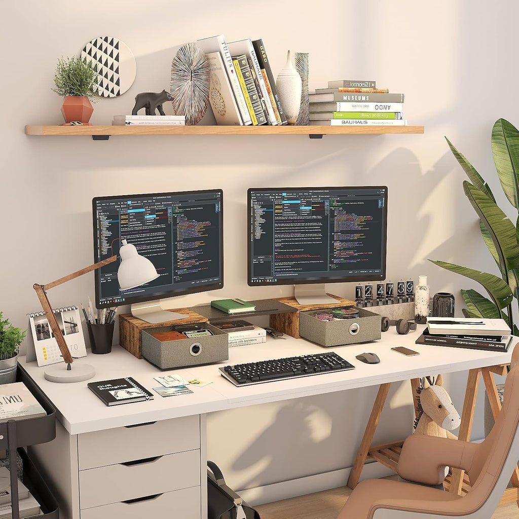 Home office desk setup with dual monitors on wooden stand