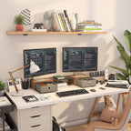 Home office desk setup with dual monitors on wooden stand