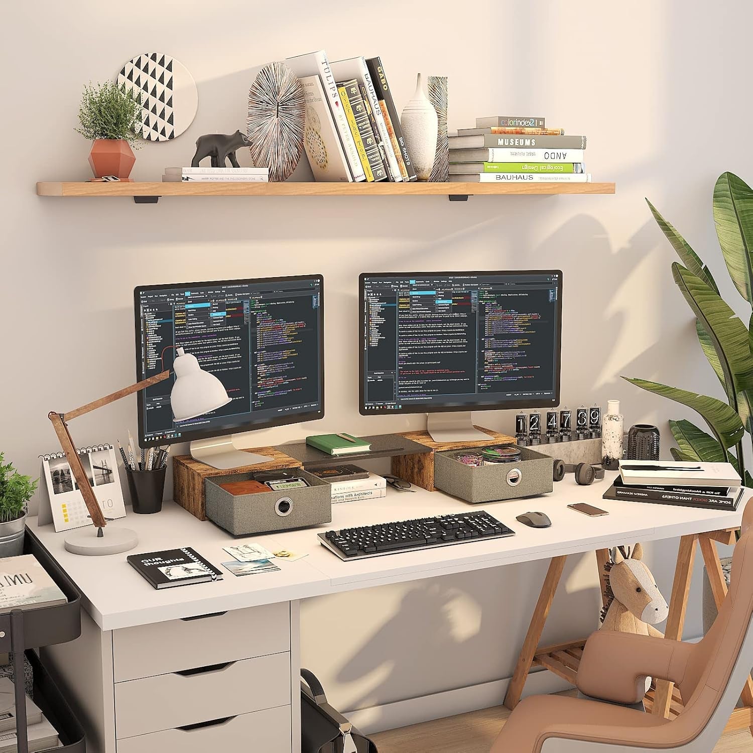 Home office desk setup with dual monitors on wooden stand