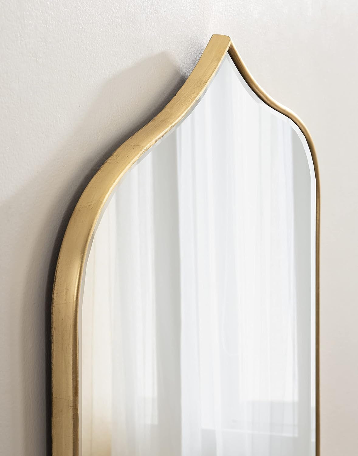 Elegant arched wall mirror with gold frame, perfect for bedroom, hallway, or vanity decor.
