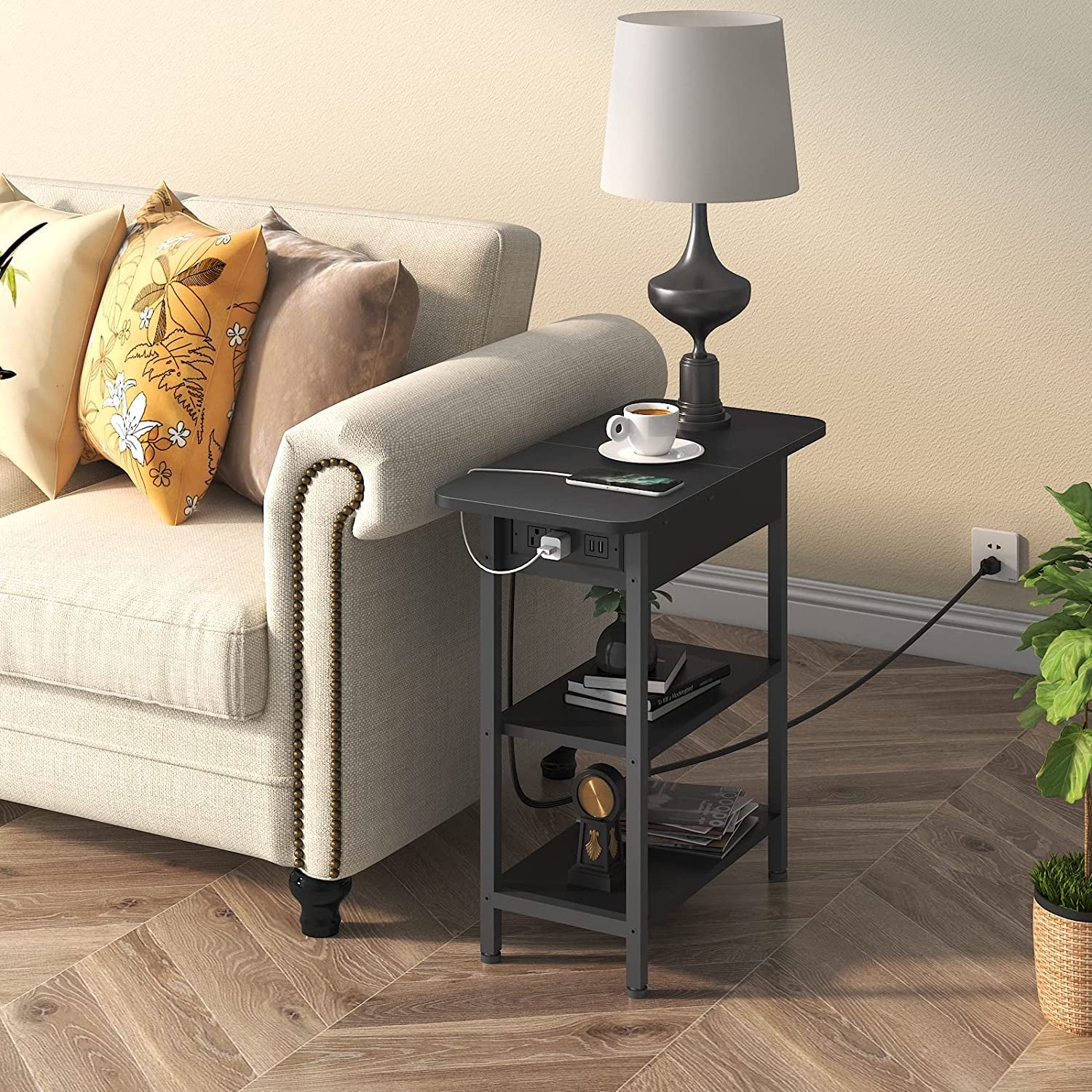 Narrow black sofa side table with shelves and built-in charging station.
