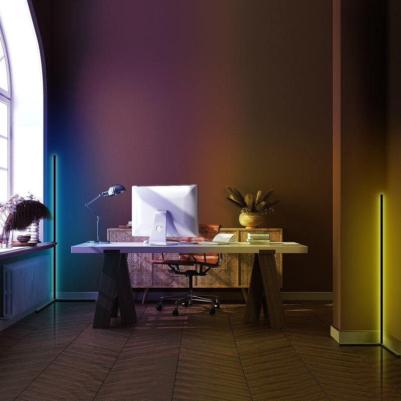 Home office desk setup with colorful LED floor lights