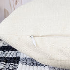 Beige pillow cover with concealed zipper closure for easy insert removal and cleaning.
