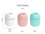 Mini humidifiers in white, pink, and green color options