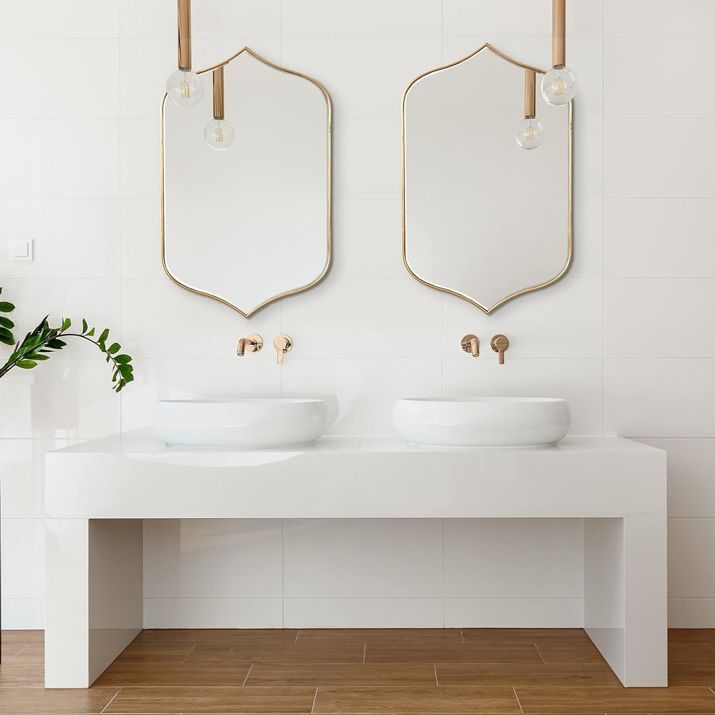 Set of two gold-framed arched wall mirrors, perfect for modern bathroom vanity decor.
