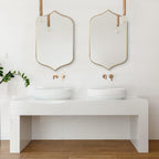 Set of two gold-framed arched wall mirrors, perfect for modern bathroom vanity decor.
