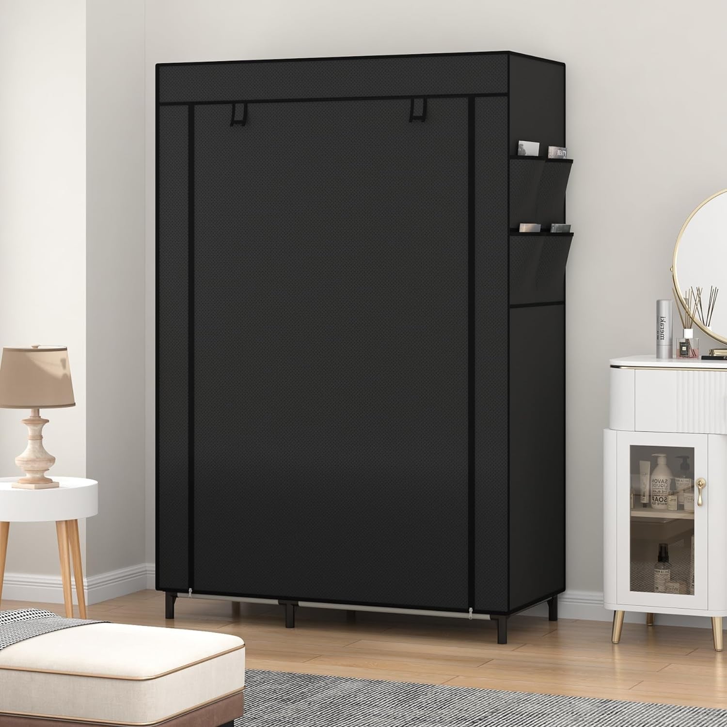 Black fabric wardrobe with cover and side pockets for neat bedroom storage.