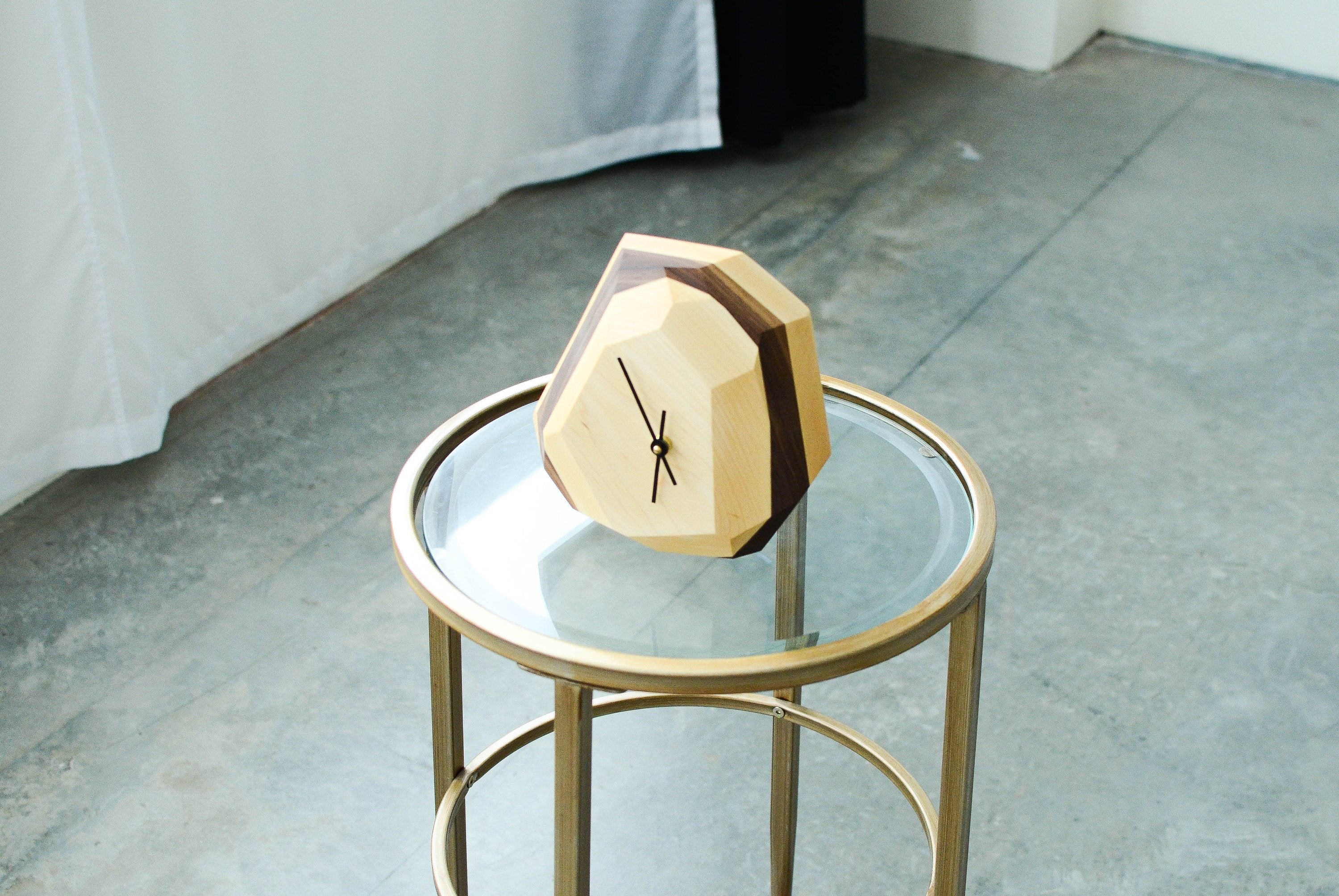 Geometric two-tone wooden desk clock with modern minimalist design.
