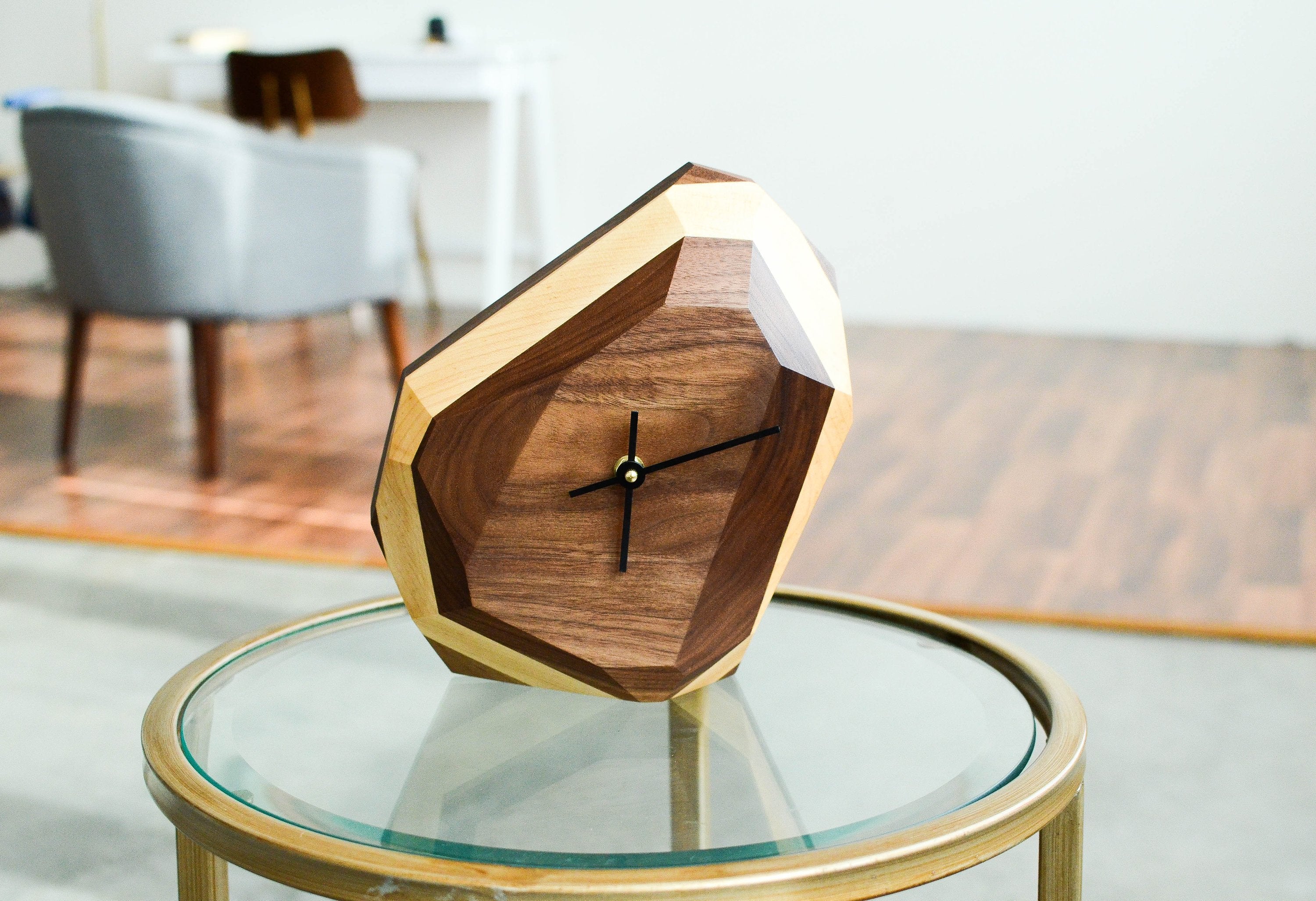 Geometric wooden desk clock with modern two-tone design for home decor.
