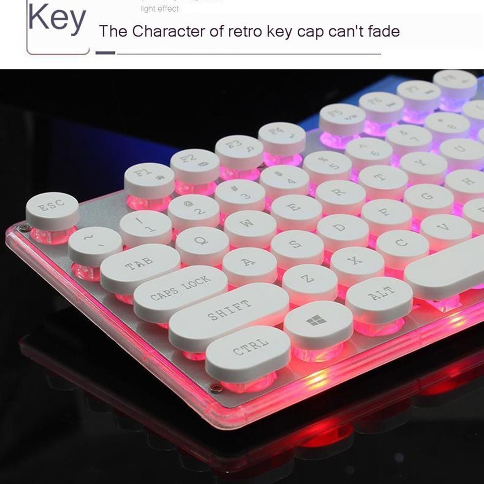 Close-up of white retro round keycaps on RGB backlit keyboard