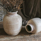 Vintage ceramic vases with textured design for rustic home and table decor.
