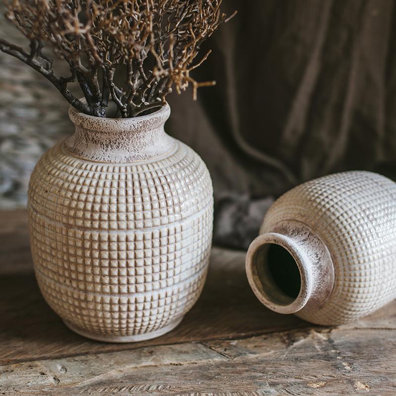 Vintage ceramic vases with textured design for rustic home and table decor.
